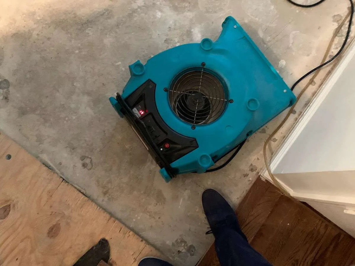 Air mover drying subfloor during Leak Detection & Repair in Wallkill
